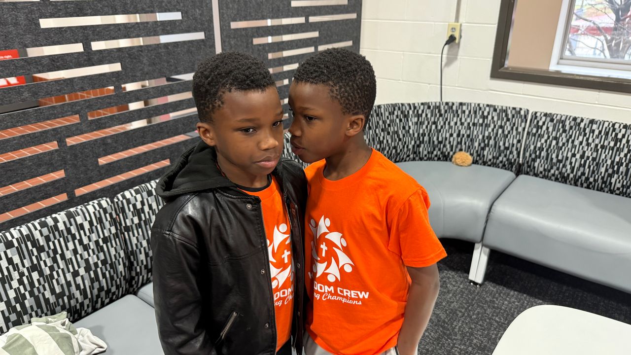Two young Kingdom Crew participants standing together