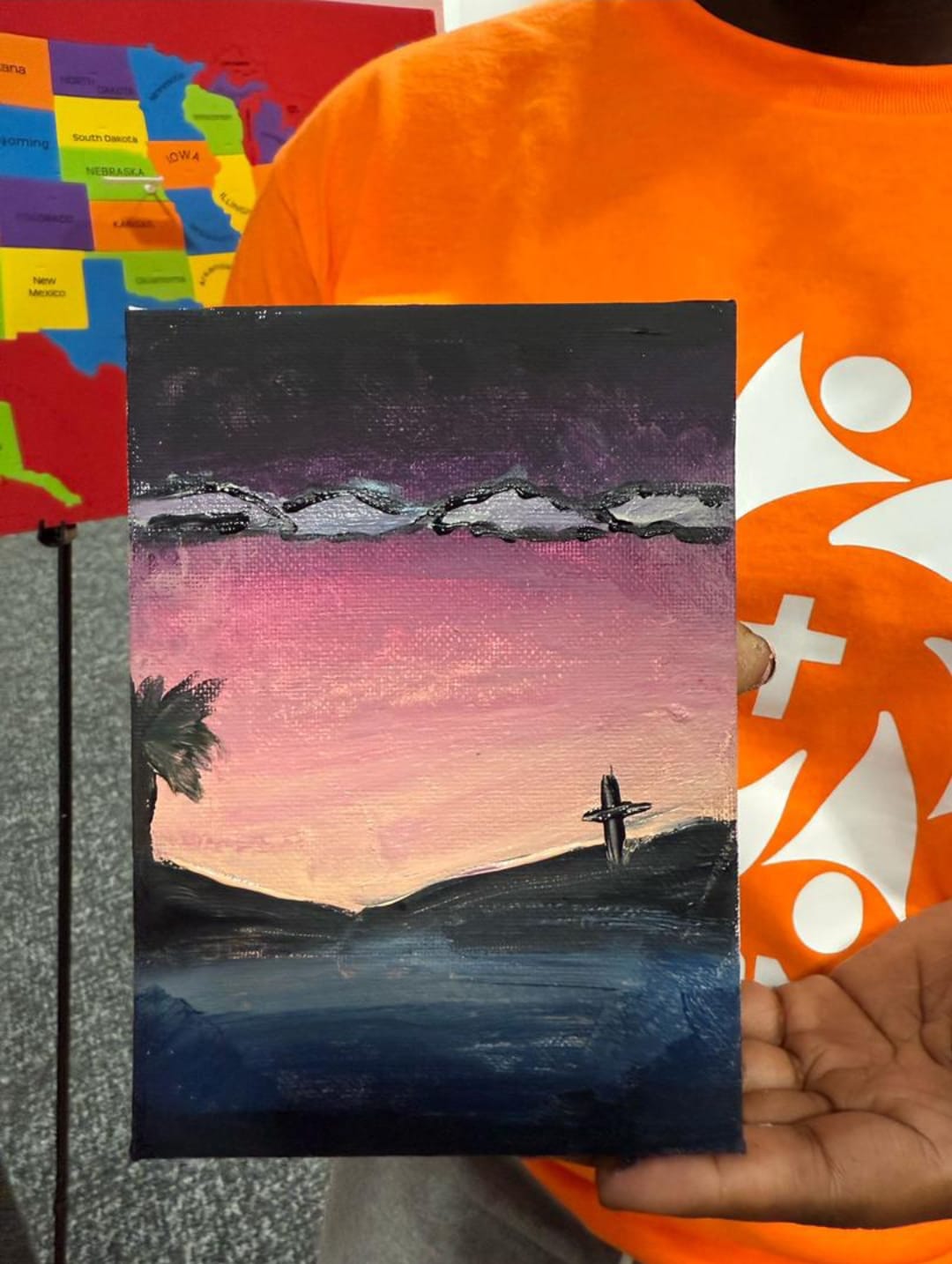 A cross-themed canvas from a Kingdom Crew painting activity